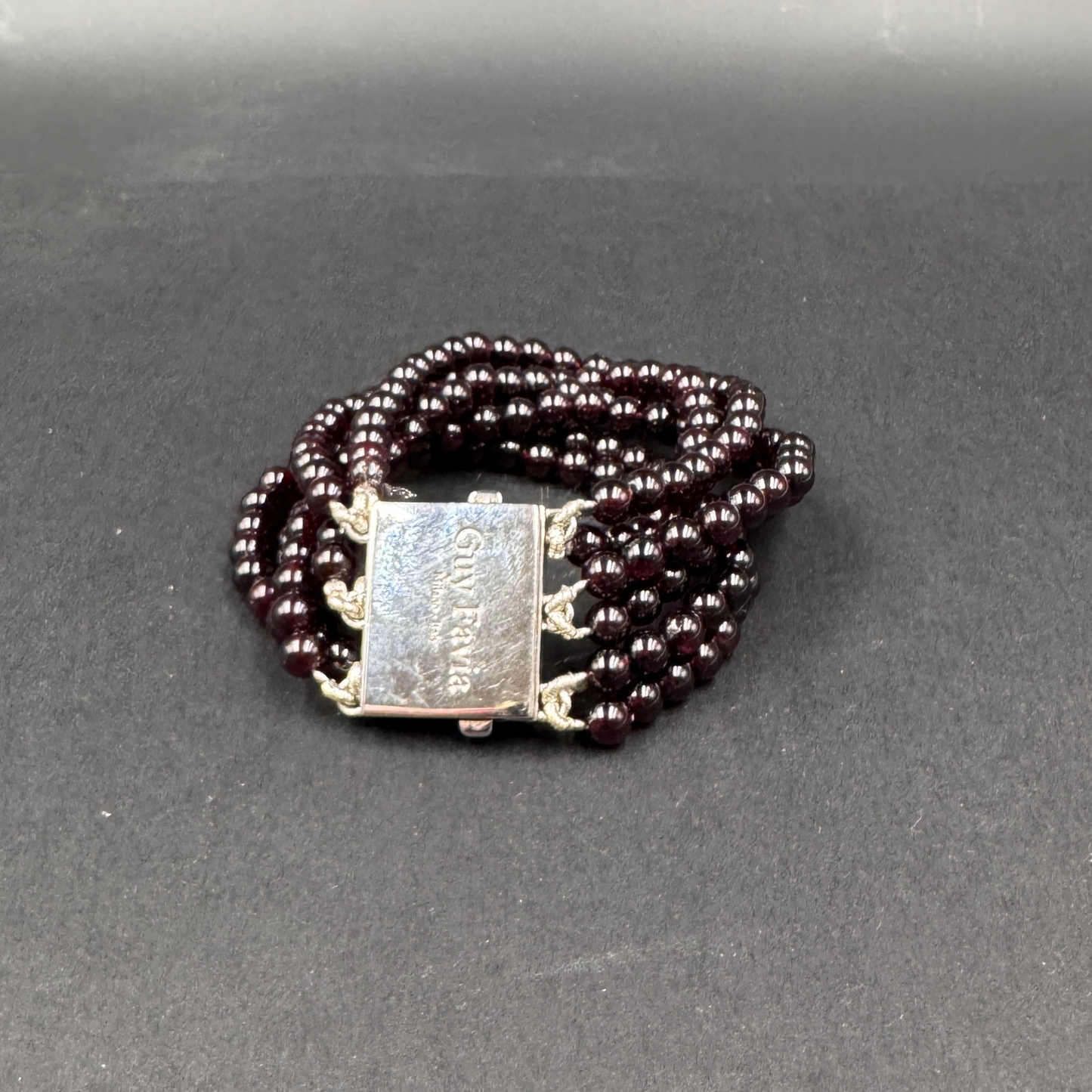 Guy Favia three-strand bracelet in red garnet and astrophillite with 925 silver clasp