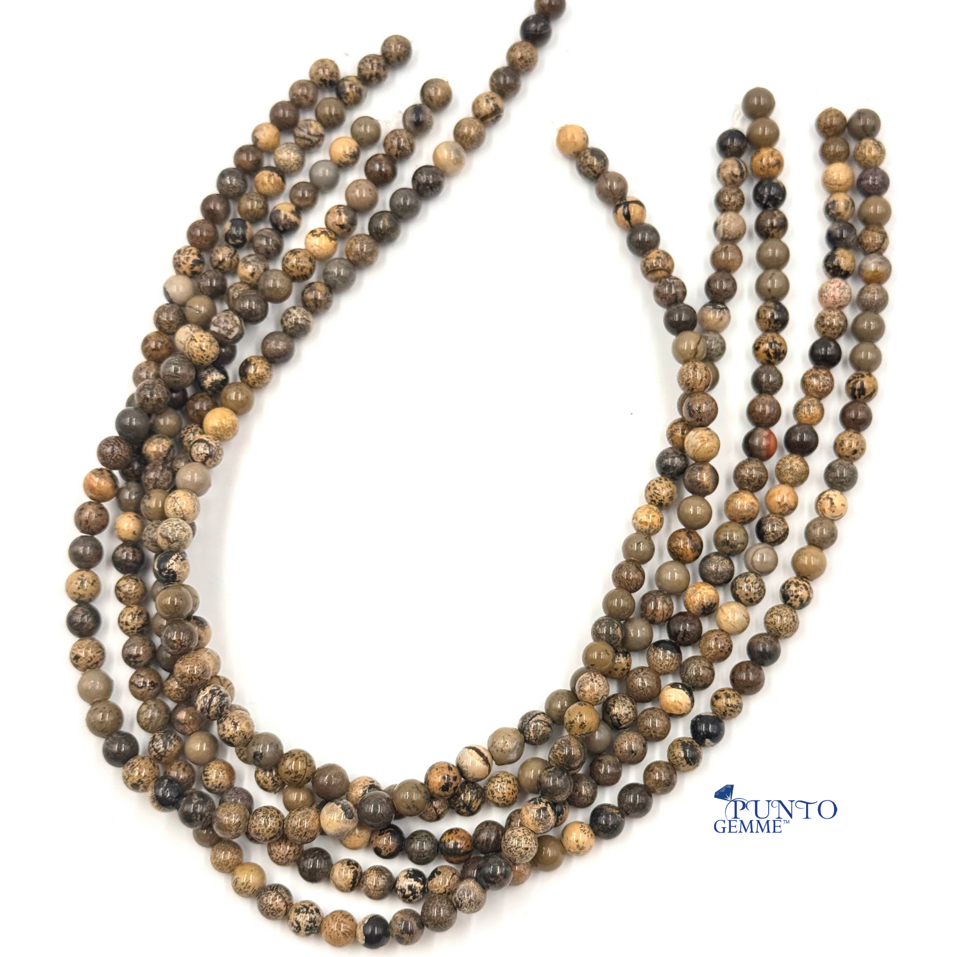 Diaspro Artic perle tonde lisce 6mm, primo piano su venature grigie e beige.