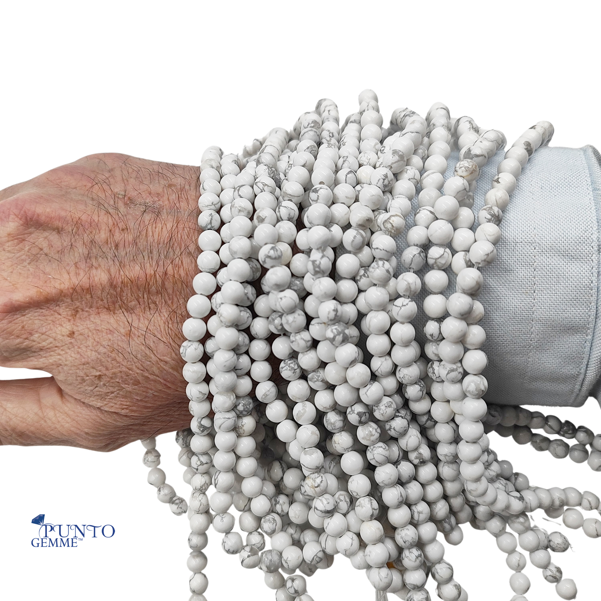 Selezione di perle di Howlite PE0420 per oreficeria, simbolo di purezza e stabilità mentale.