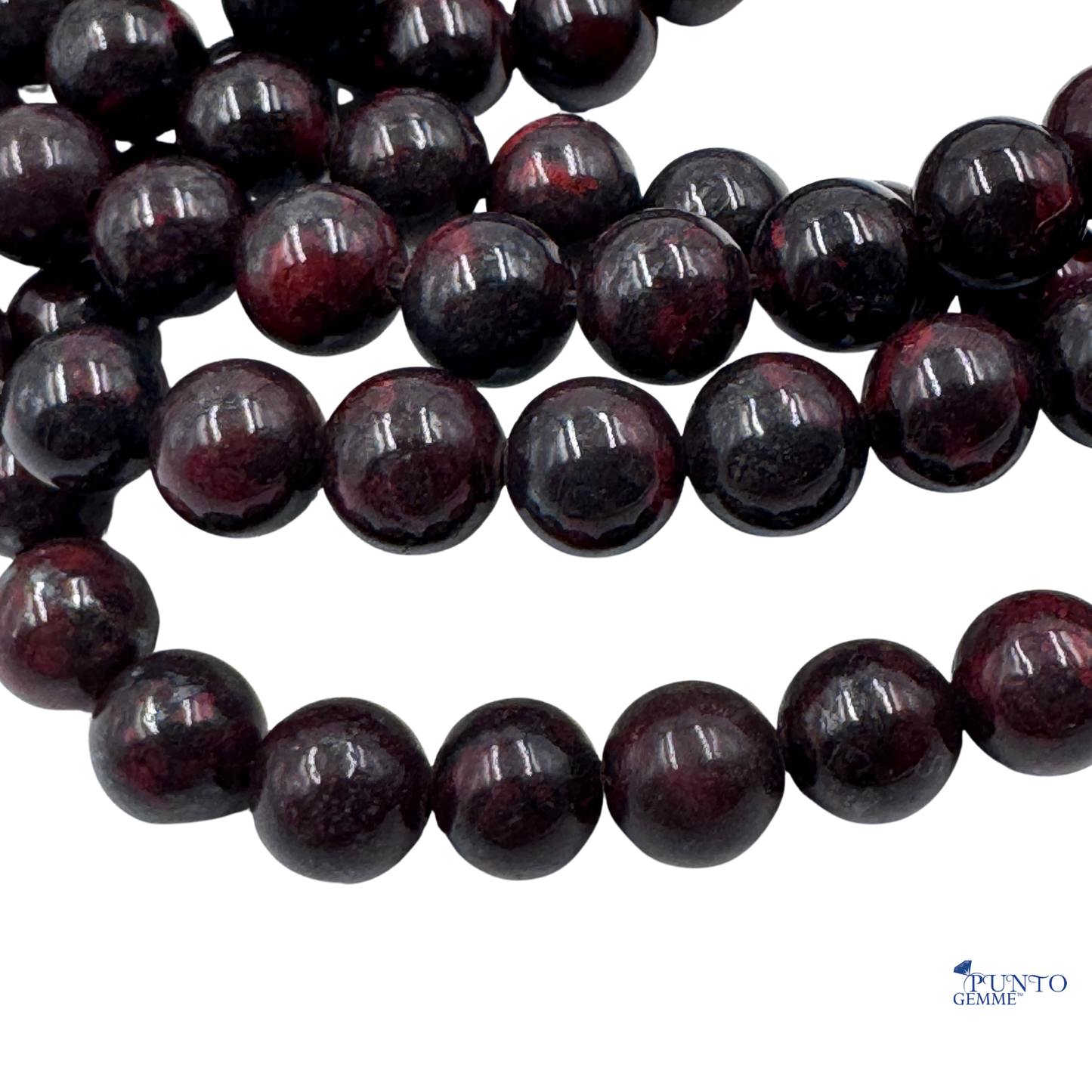 Filo di perle sferiche lisce di Diaspro Poppy naturale, con evidenti macchie rosse e arancioni.