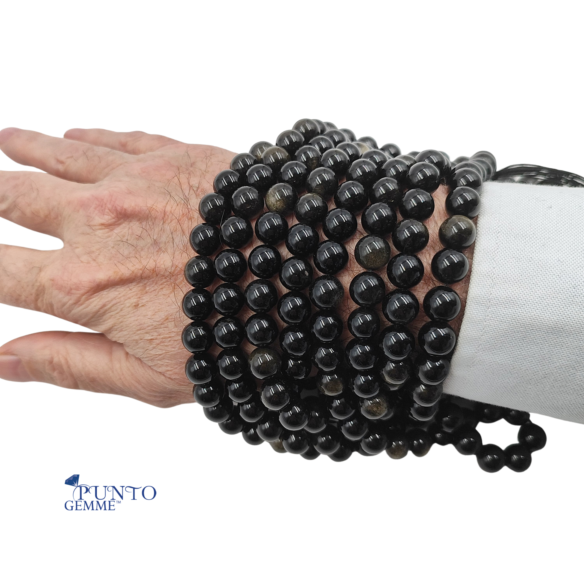 Dettaglio macro di una perla da 10mm di Ossidiana Gold con effetto ottico dorato interno.