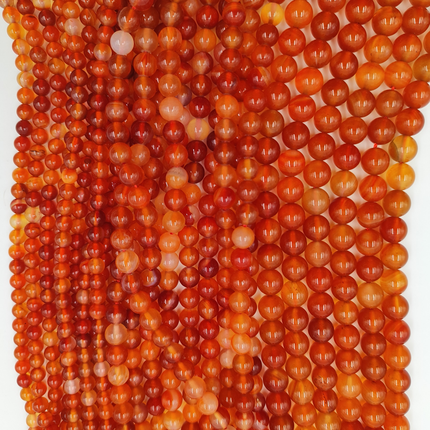 Selezione di fili di Corniola certificata per la creazione di gioielli energetici e cristalloterapia.