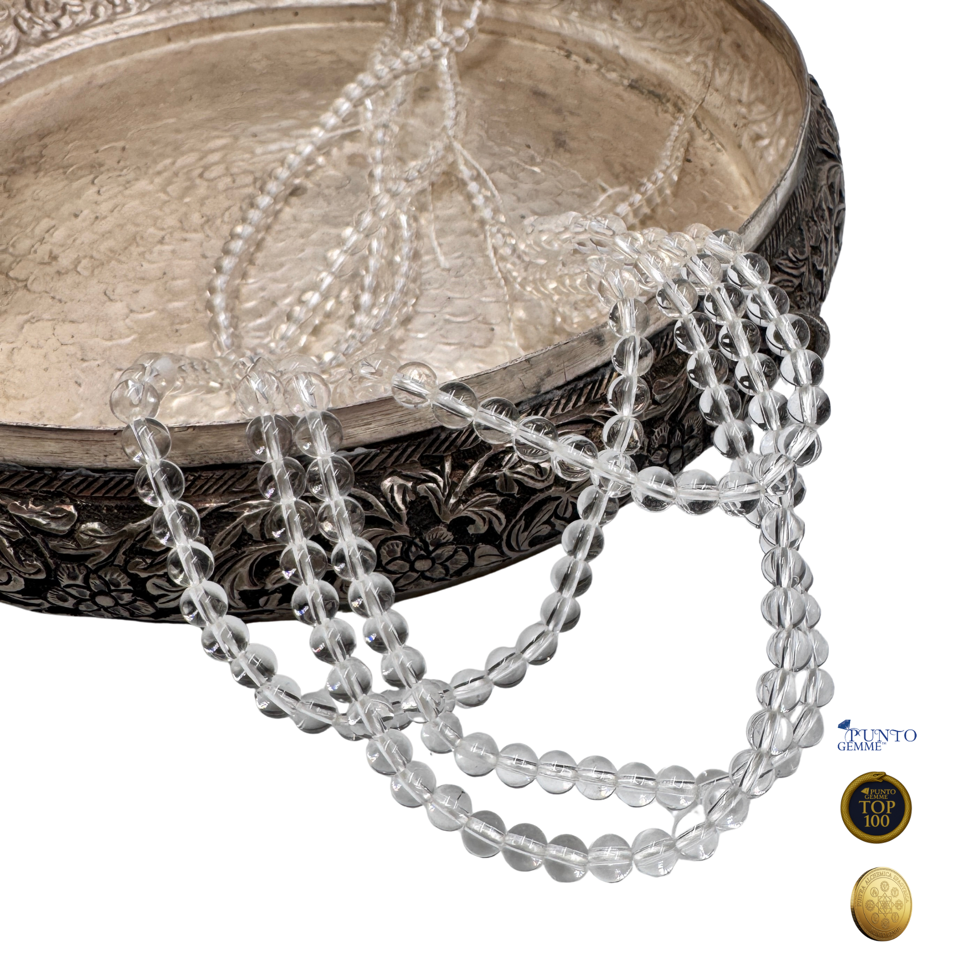 Scatto macro di perle tonde in Quarzo Ialino Grado AA, il Maestro Guaritore che bilancia tutti i Chakra.