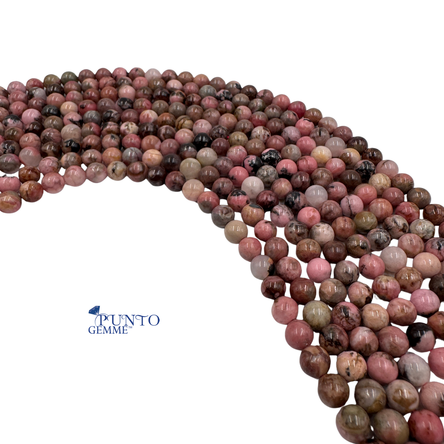 Primo piano PE0817, che mostra il contrasto tra il rosa e le inclusioni nere di manganese.