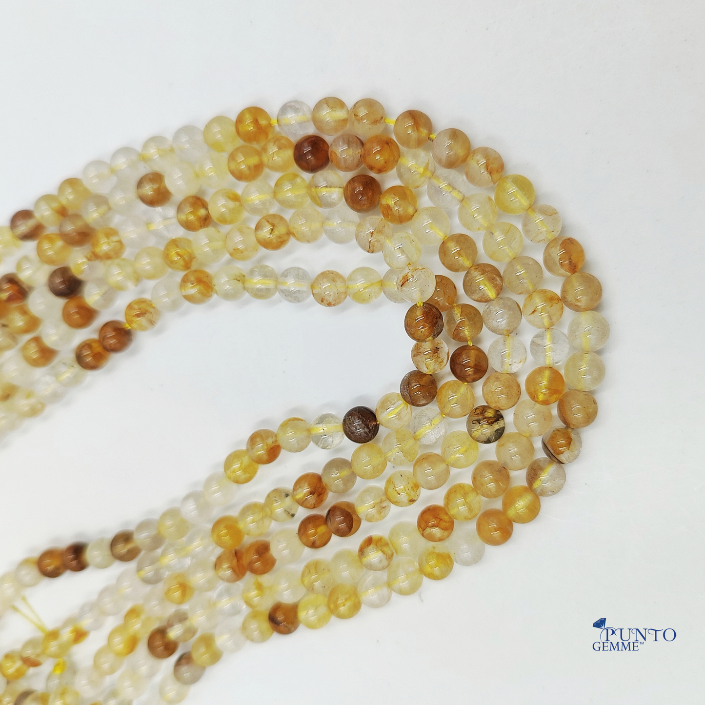 Filo di Quarzo di Limonite su sfondo bianco per mostrare la varietà del colore.