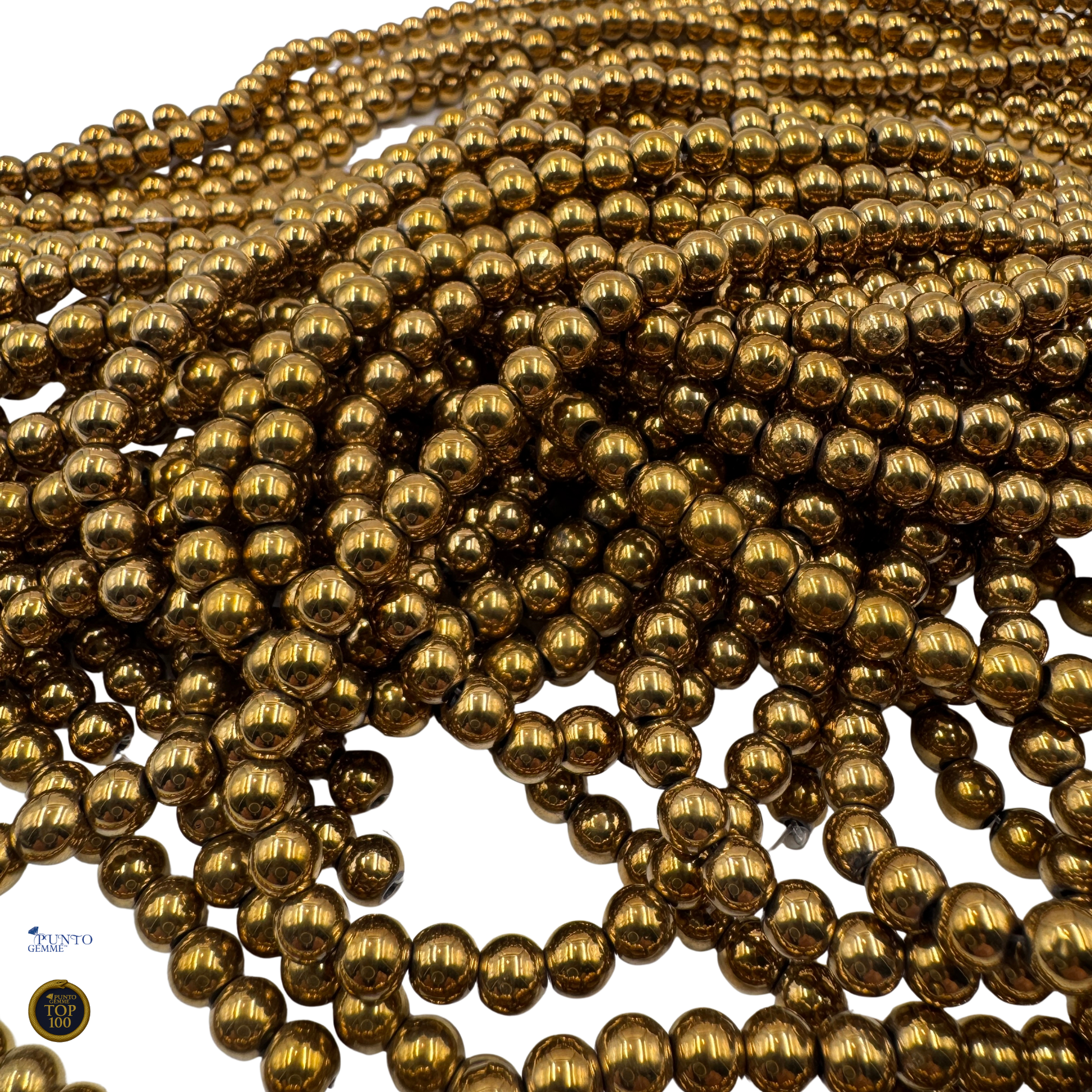 Primo piano delle perle, che mostra la finitura liscia e la brillantezza del colore Oro.