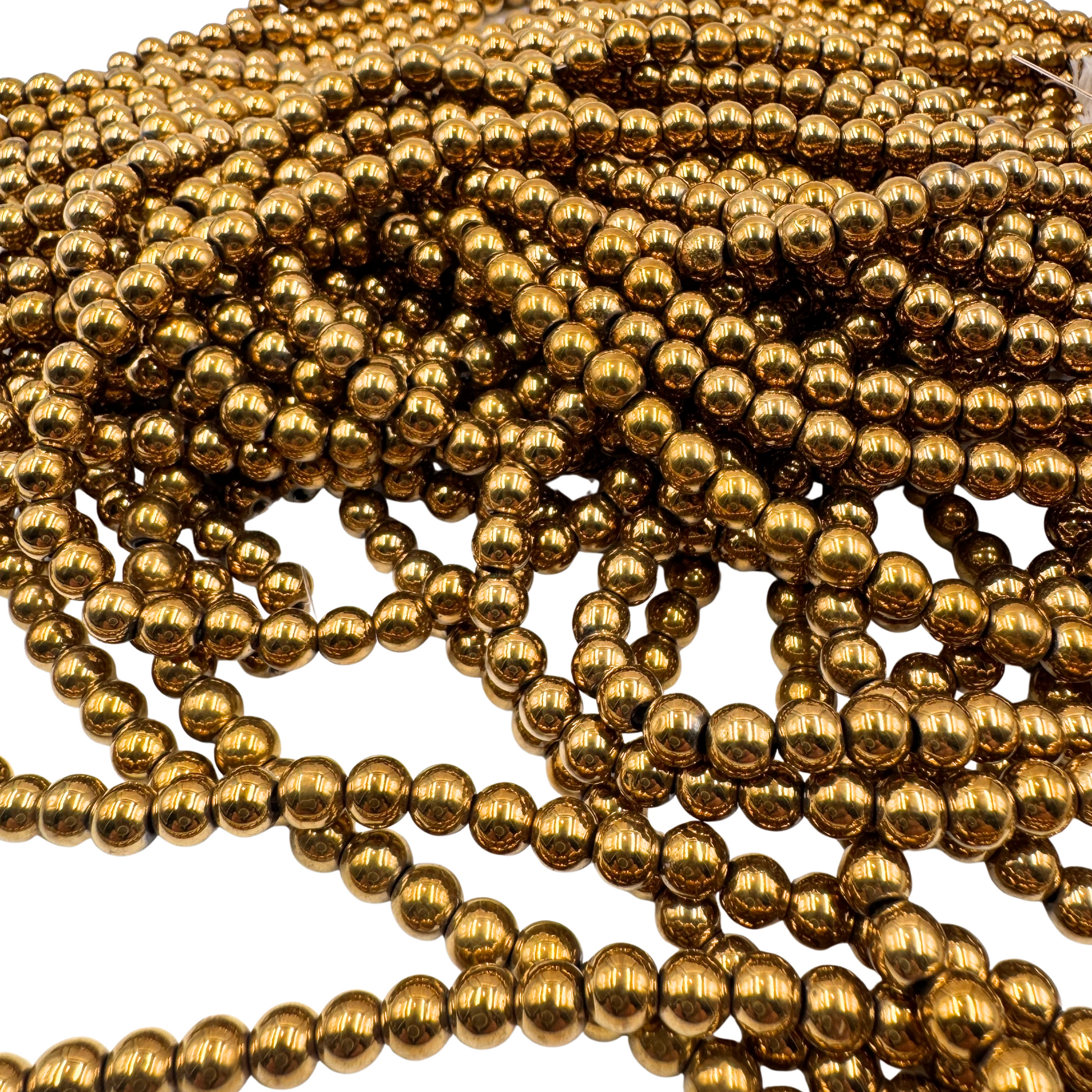 Foto d'insieme perle, che mostra la finitura liscia e la brillantezza del colore Oro.