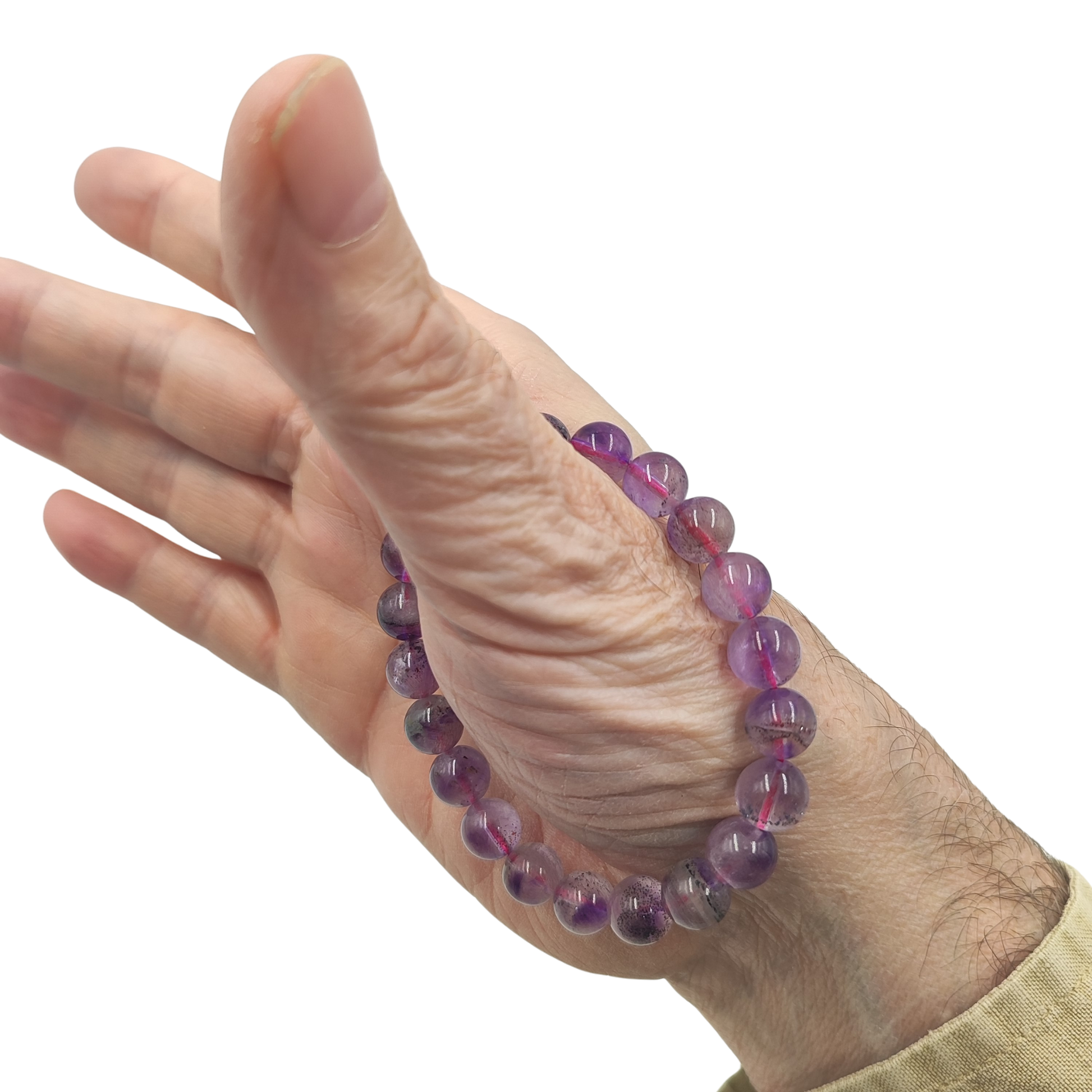 Bracciale Super Seven naturale PE6014 con perle tonda liscia che mostrano inclusioni di ametista e rutilo.