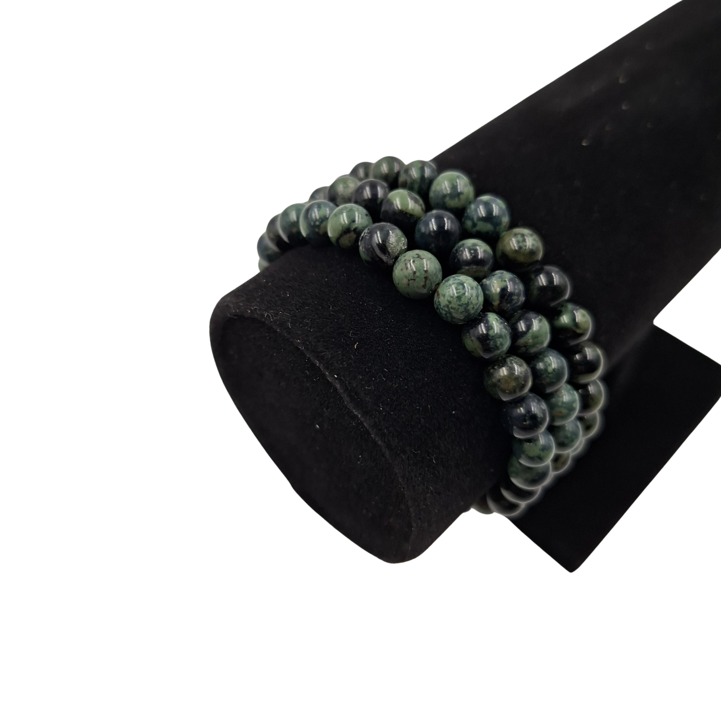 Il bracciale in Diaspro Kambaba indossato su un polso, evidenziando il taglio da e i motivi a vortice.