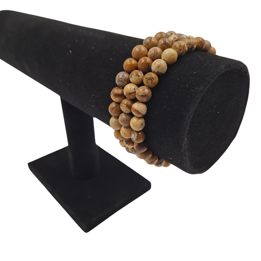 Bracciale elastico in Pietra Paesina, Tonda Liscia , che mostra i pattern unici a effetto "paesaggio".