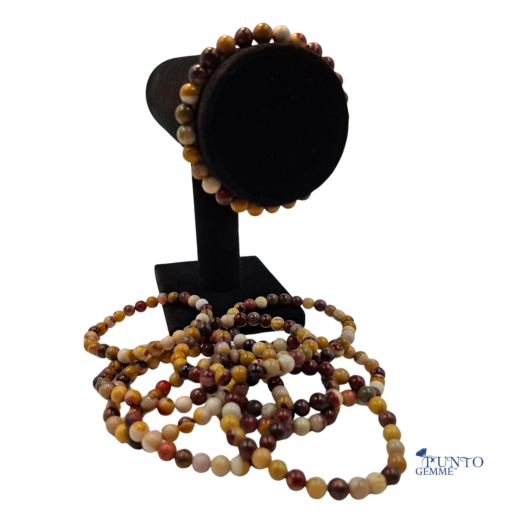 Bracciale elastico in Mookaite Punto gemme, che mostra la gamma di colori naturali rosso, giallo e viola.