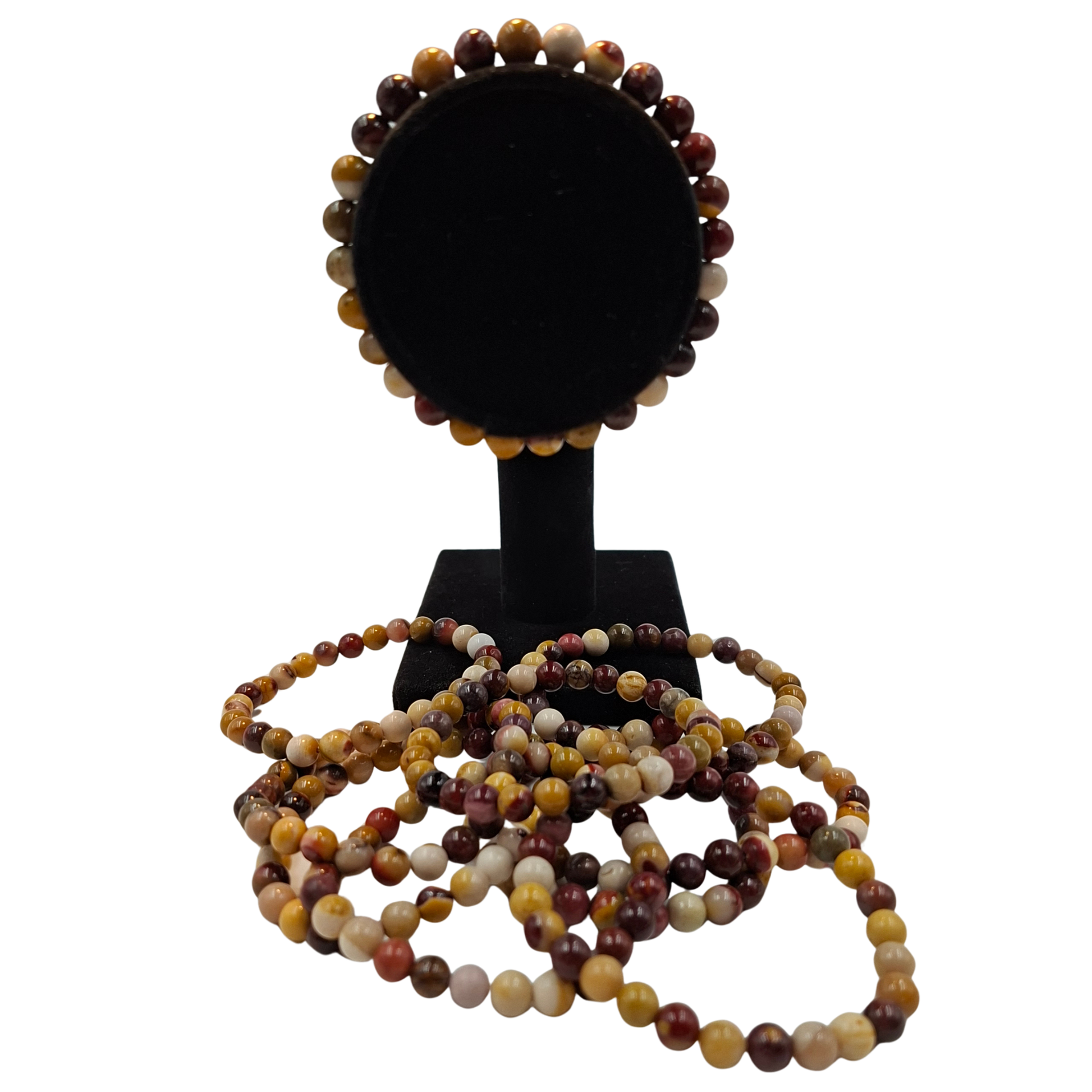 Bracciale elastico in Mookaite 6mm, che mostra la gamma di colori naturali rosso, giallo e viola.