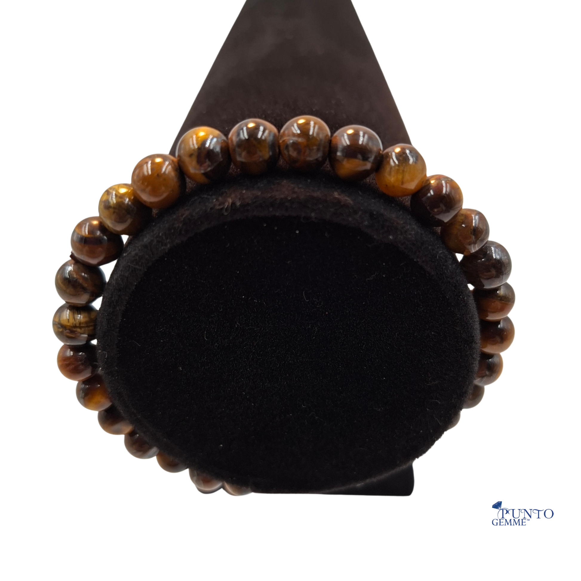 Scatto del bracciale elastico Occhio di Tigre arrotolato su un piano, per enfatizzare la sua ricca colorazione marrone.