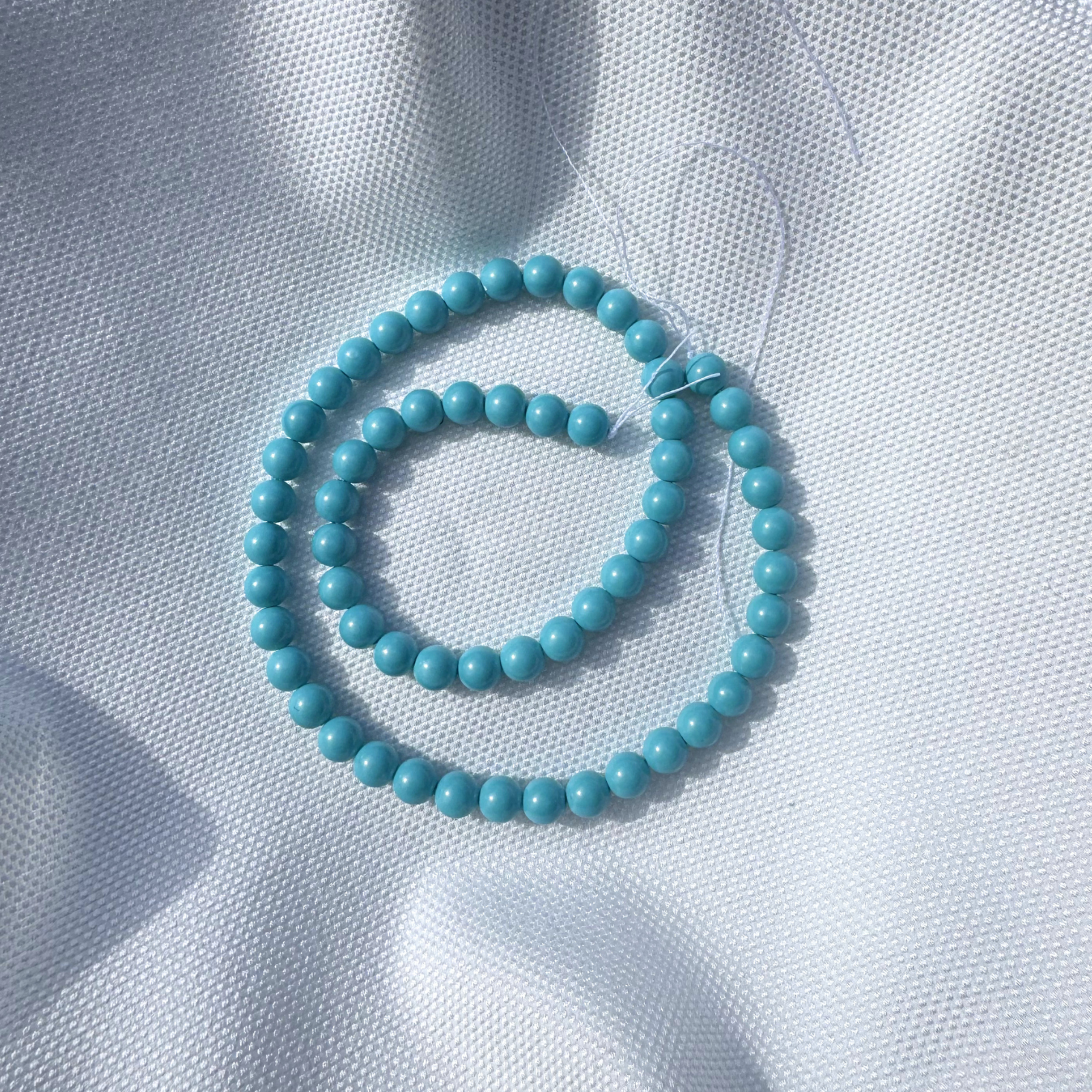 filo perle elegance turchese tonde 4 mm.